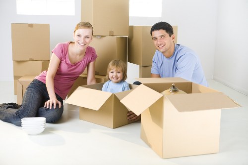 Removal team loading boxes for a home move in Holland Park