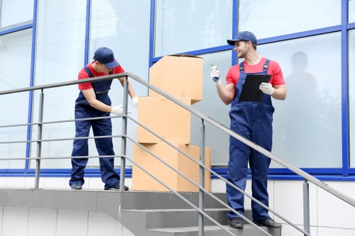 Professional movers preparing a residential move in Holland Park