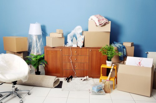 Professional office movers handling desks and equipment in West London