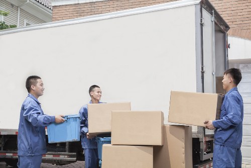 Staff member trained in safe lifting techniques during a house move