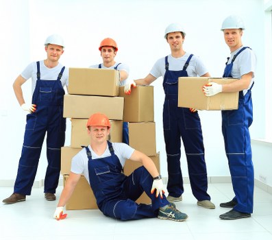 Removal team preparing a move in a Holland Park residential street