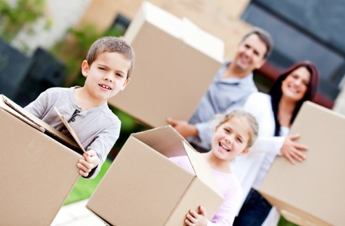 Movers handling apartment furniture and protected items during a Holland Park relocation