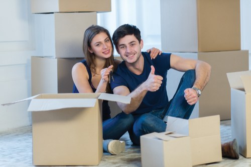 Local Holland Park moving team handling furniture and boxes