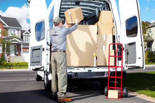A local removal van outside a Holland Park property with careful loading access