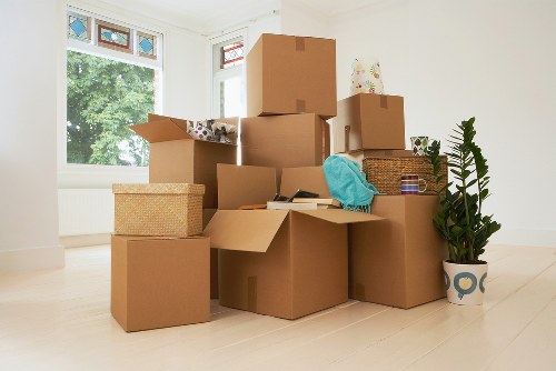 Packed moving boxes ready for a removal van service in Holland Park
