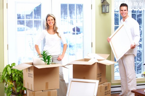 Office relocation items being carried into a van