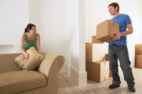 Moving boxes and household items ready for transport in Holland Park