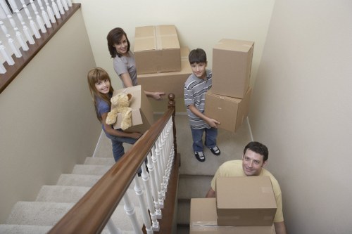 Professional movers handling household items with care